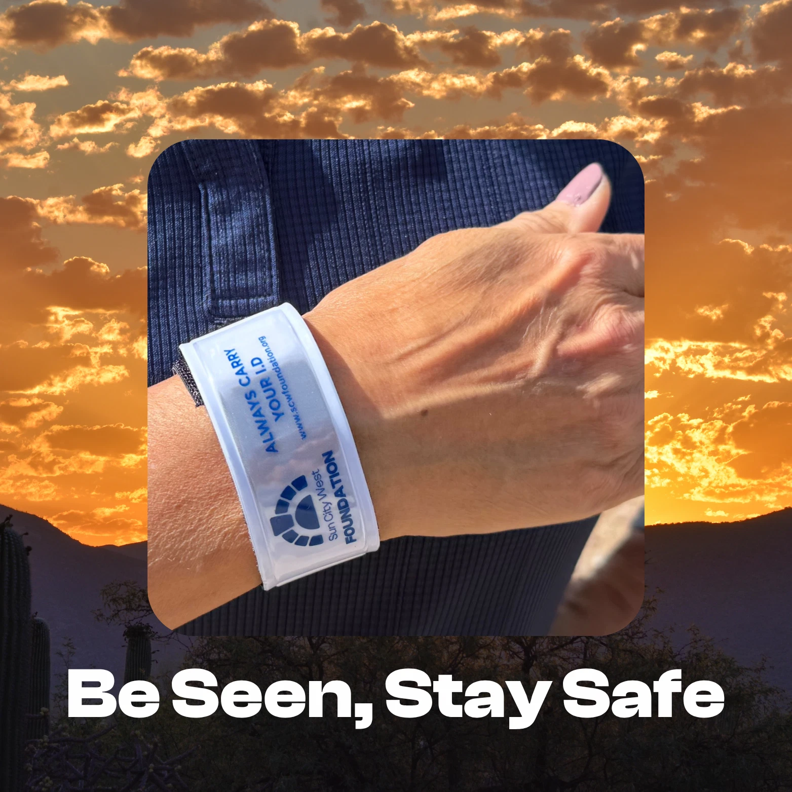 A person's wrist, adorned with a white "Always Carry Your I.D." wristband.