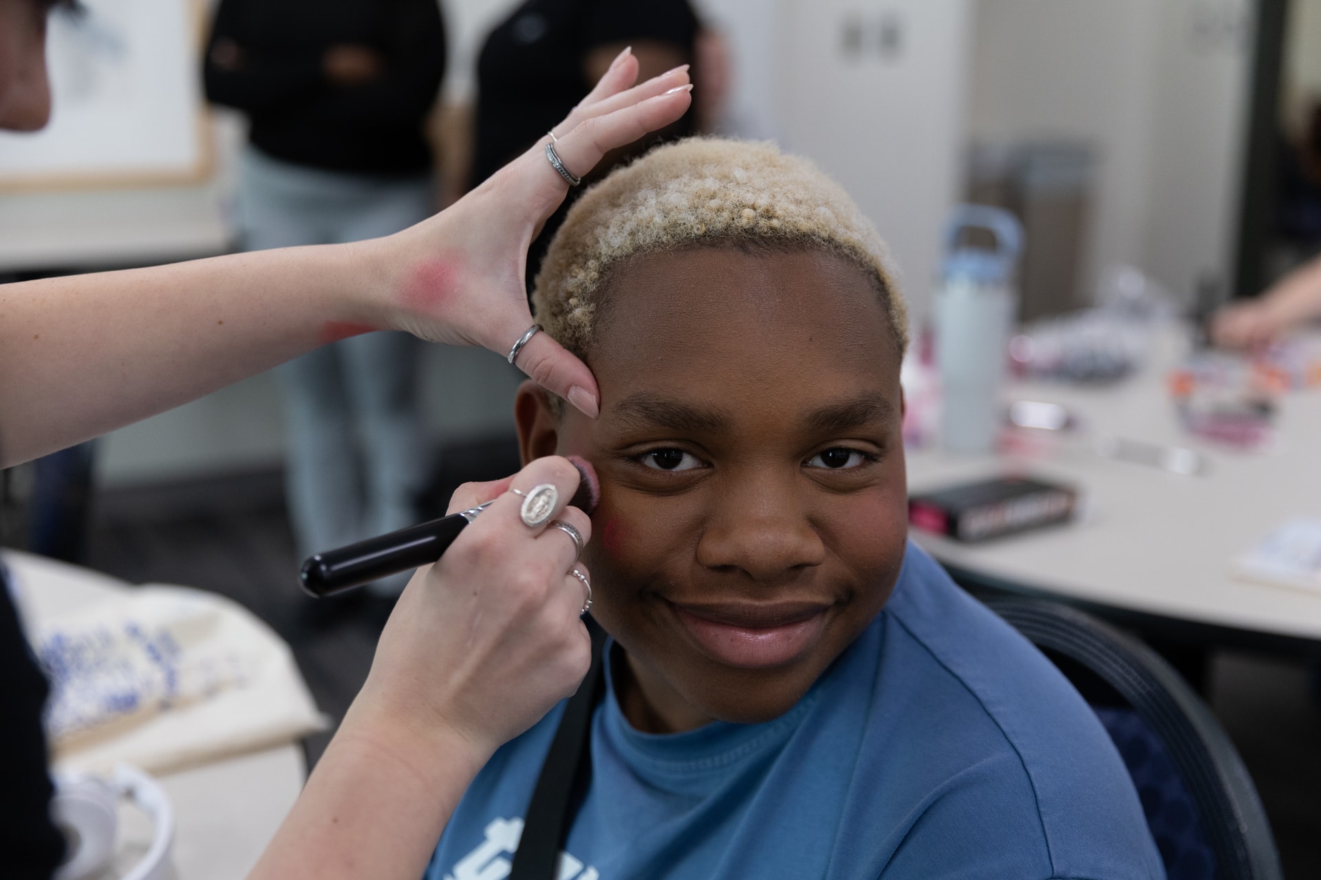 student getting drag makeover