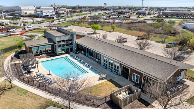 Drone photo of apartment community and pool
